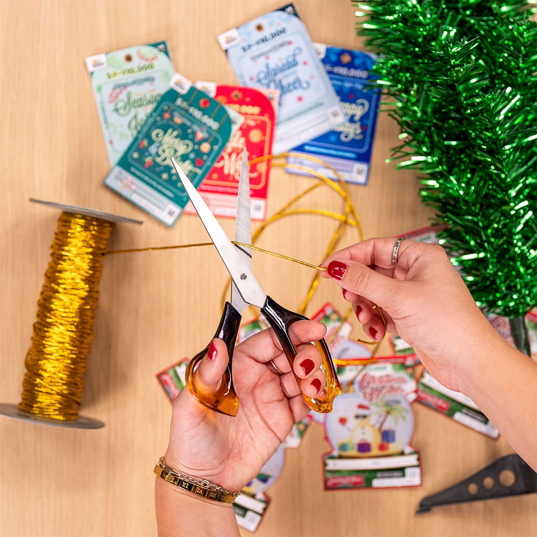 scissors cut gold string for scratchie gift